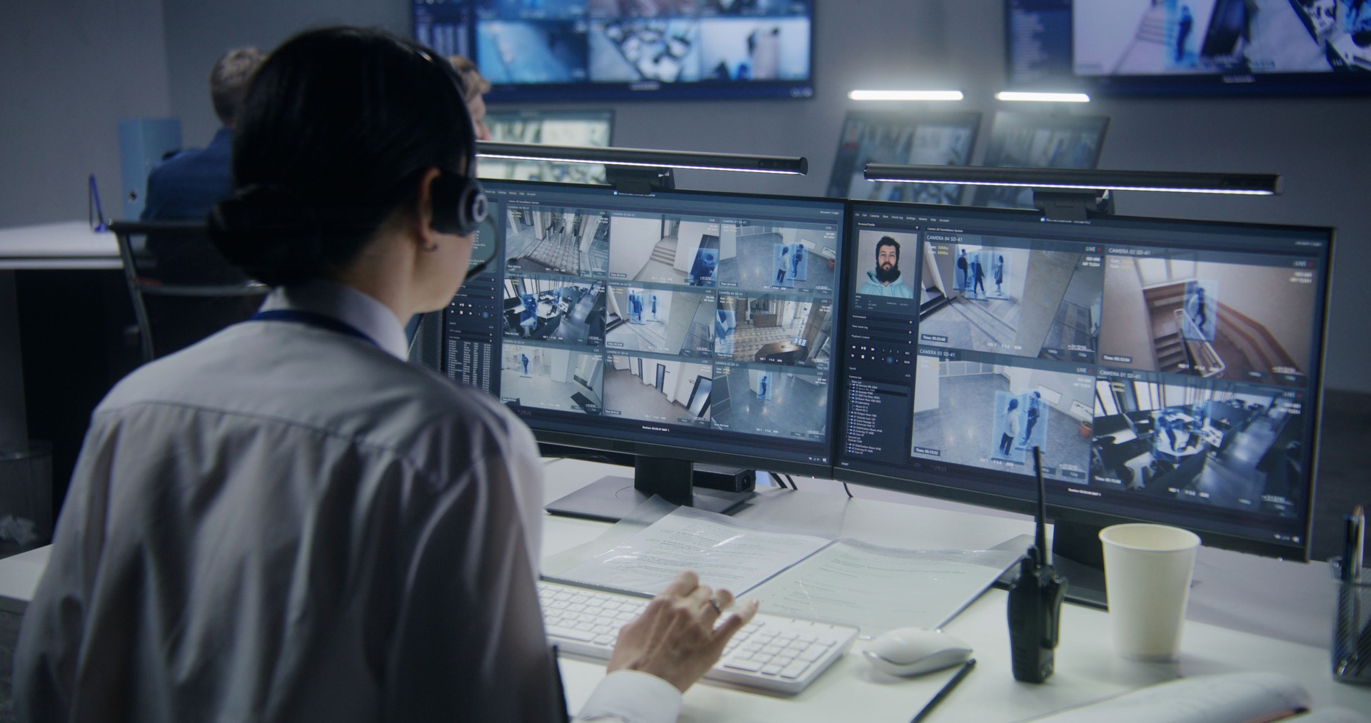 Female employee works in security control center